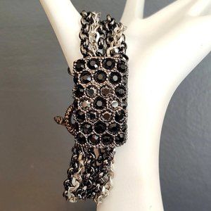 Black, silver and gray metal and crystal multi strand bracelet